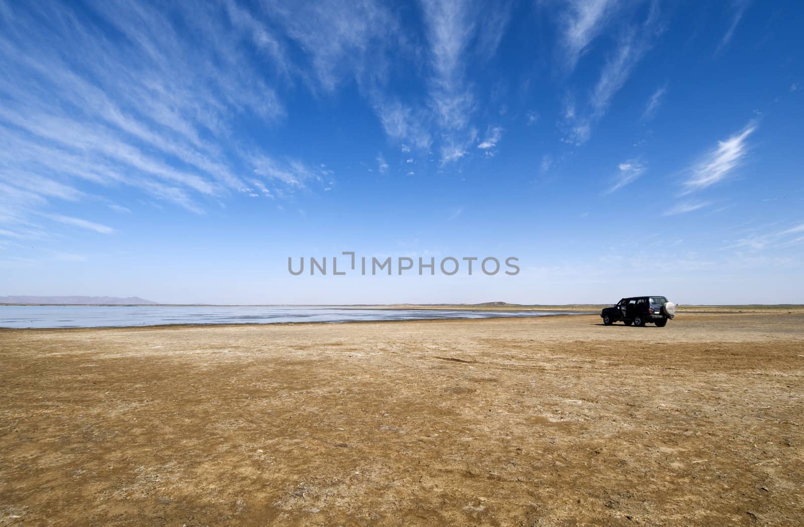 Lake in the Sahara desert with a off-road 4wd car - Near Merzouga - Best of Morocco
