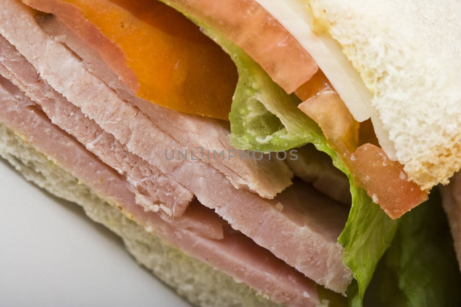 close up of a  ham and cheese sandwich
