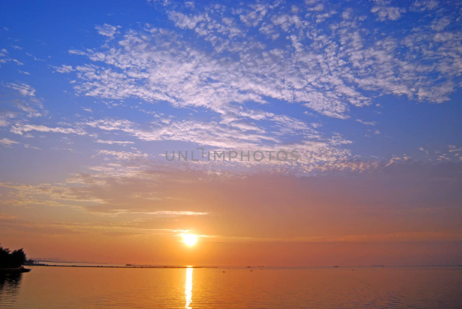 unset over Ocean. Haikou's Bay, CHina