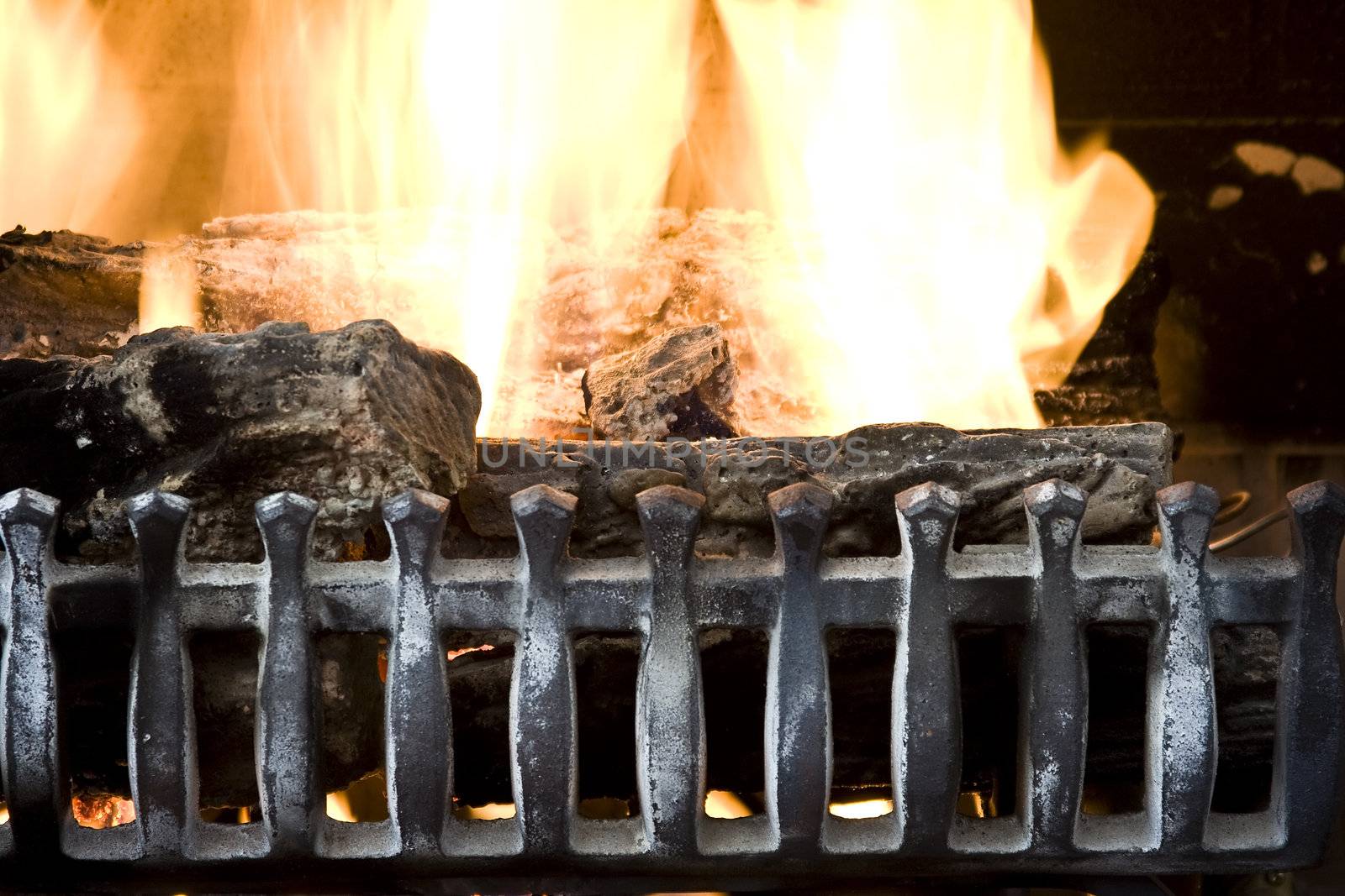 fire burning in a fireplace close up background photo