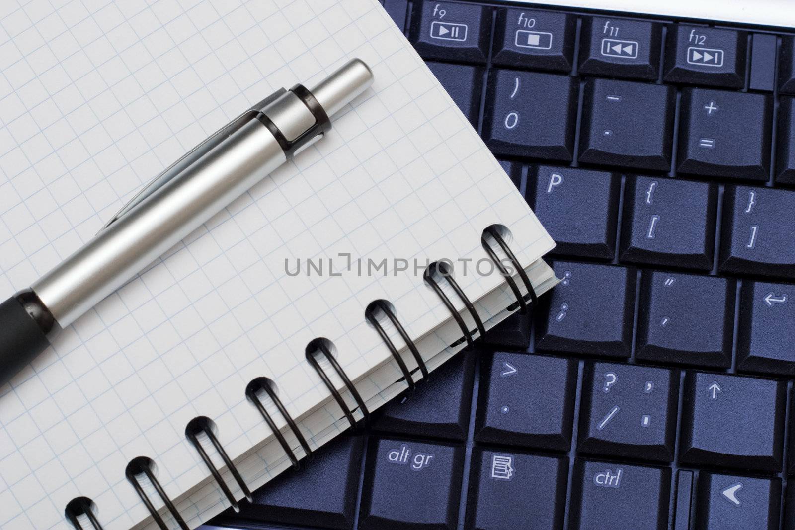 Business objects: pen, diary and a keyboard. Business background for any use