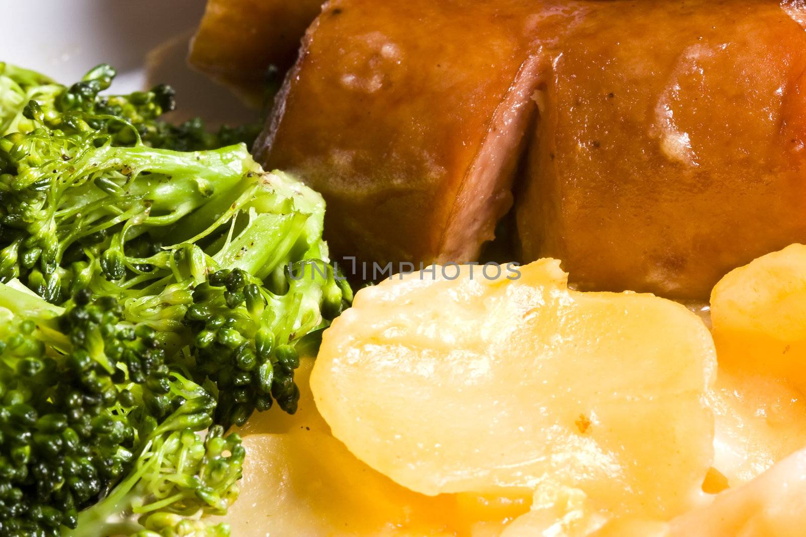 nice home cooked meal of sausage potatoes and broccoli 