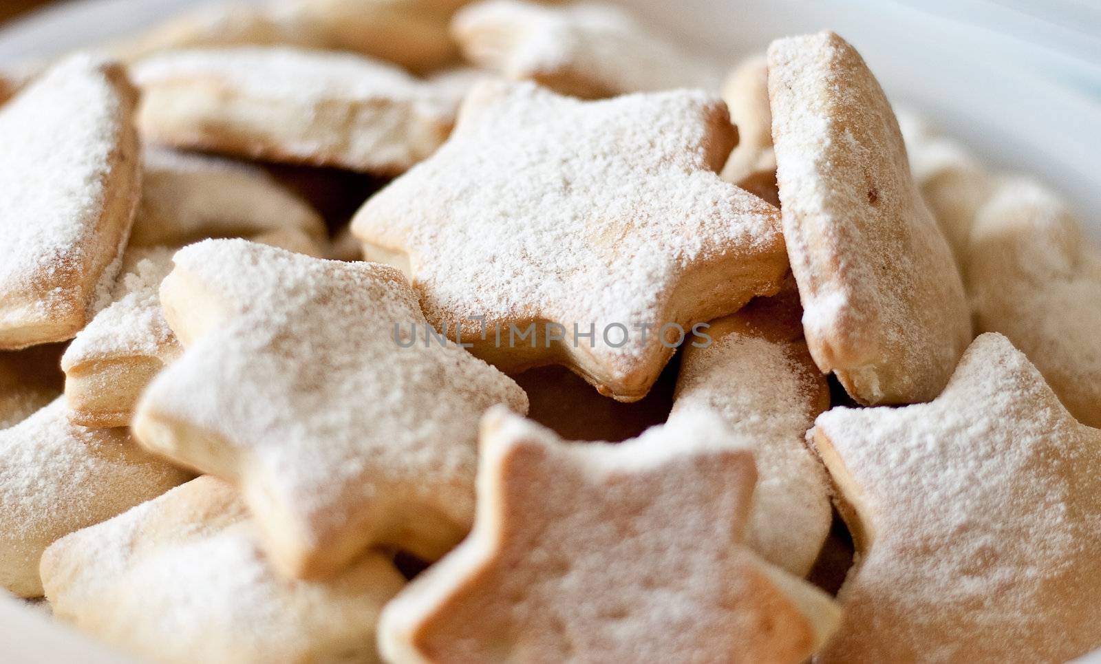 Homemade cookies sprinkled powder sugar.