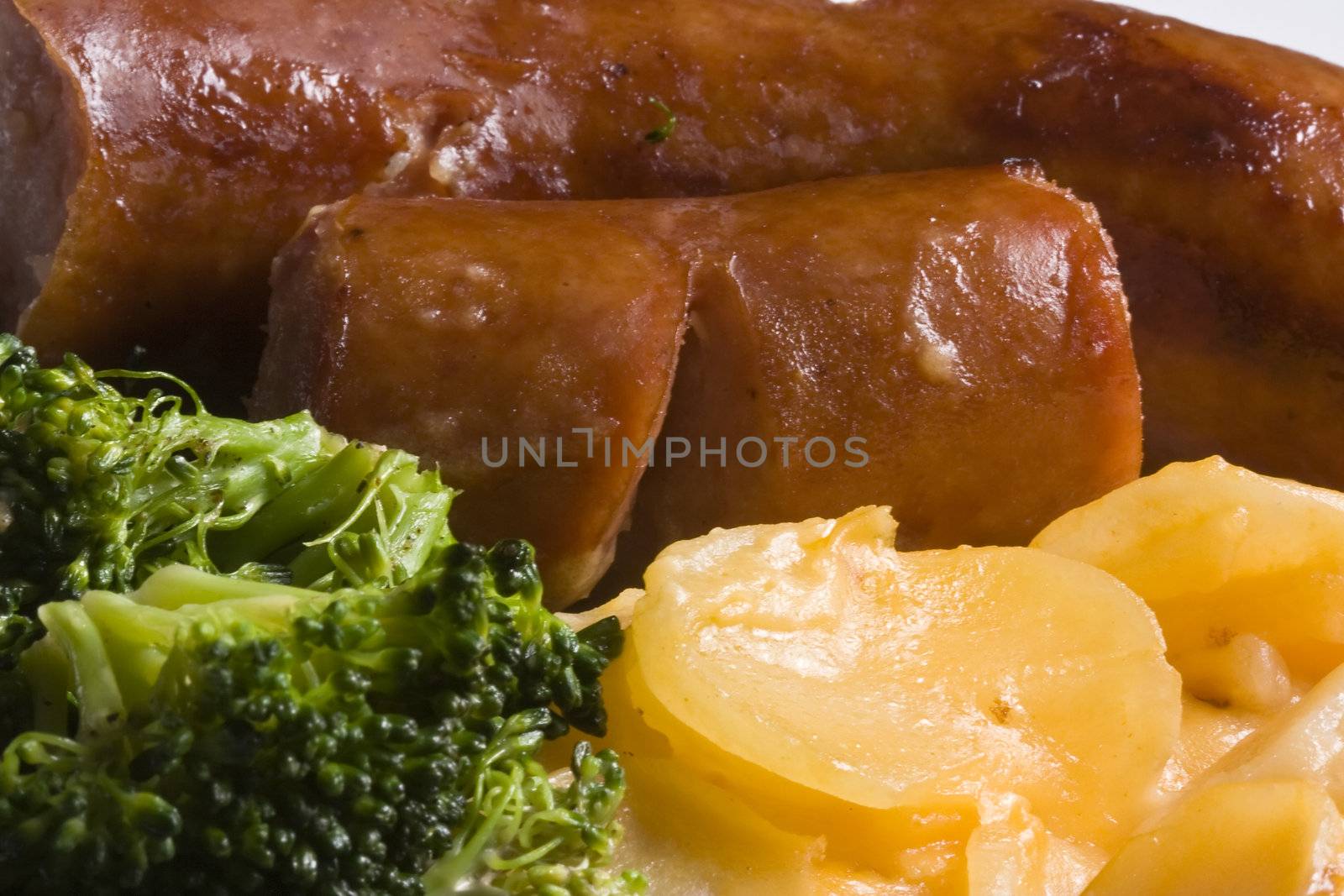 nice home cooked meal of sausage potatoes and broccoli 