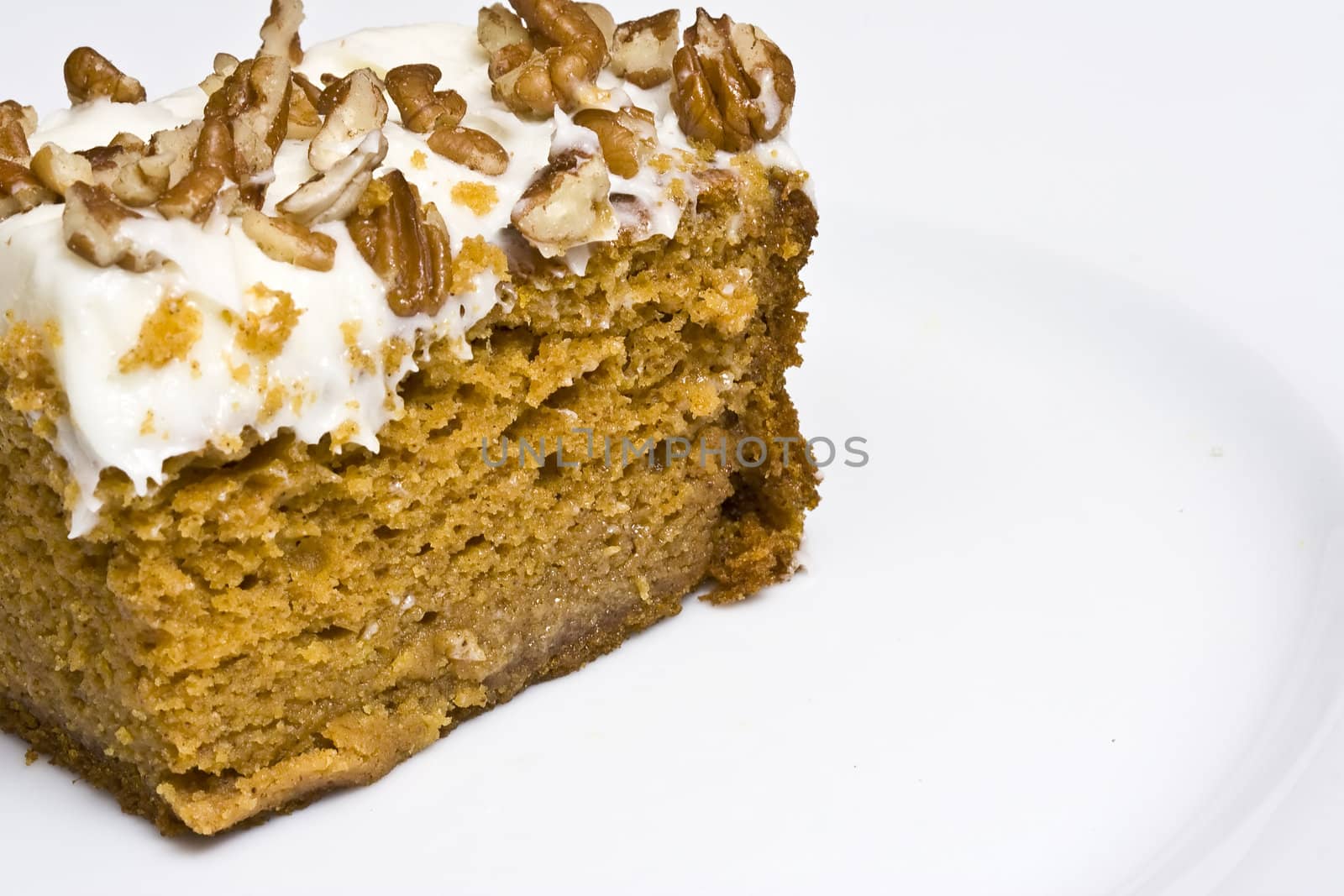slice of pumpkin cake with cream cheese frosting, could pass for carrot cake though