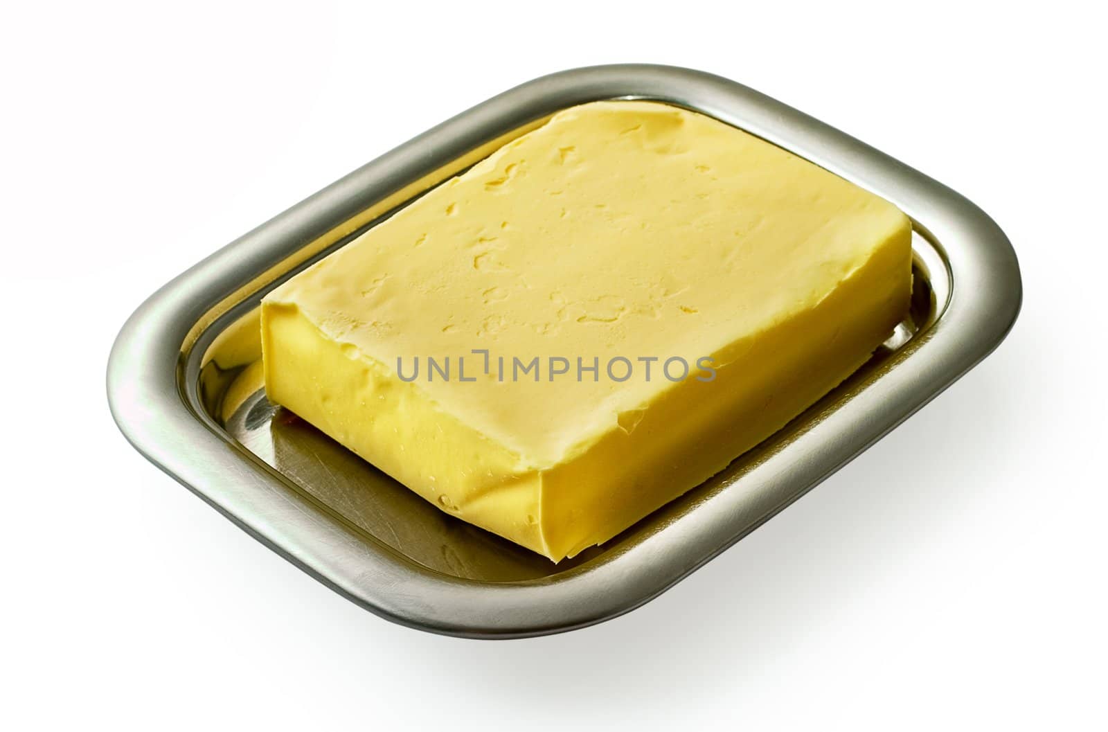 Butter on silver butter dish isolated on white background.