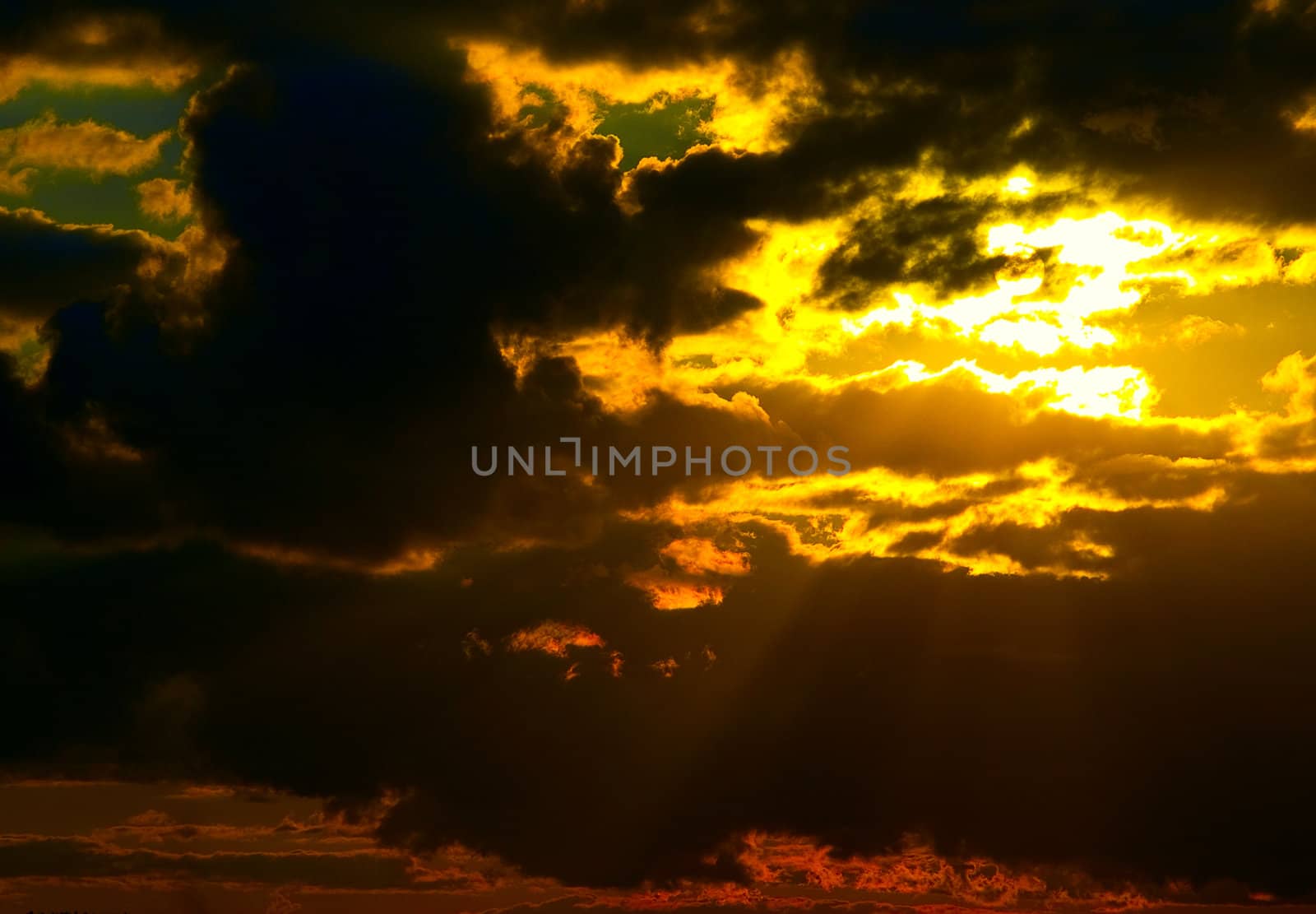 Sun behind storm-cloud
