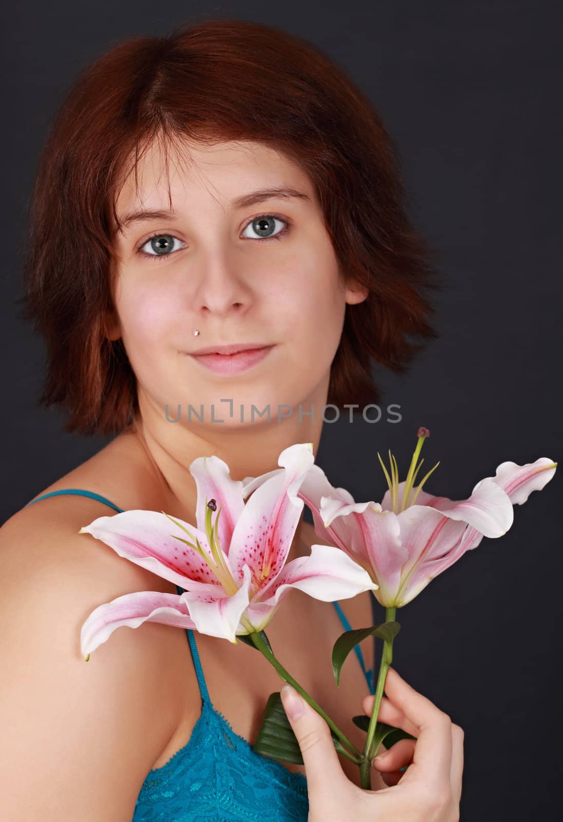 young caucasian woman with lily flowers