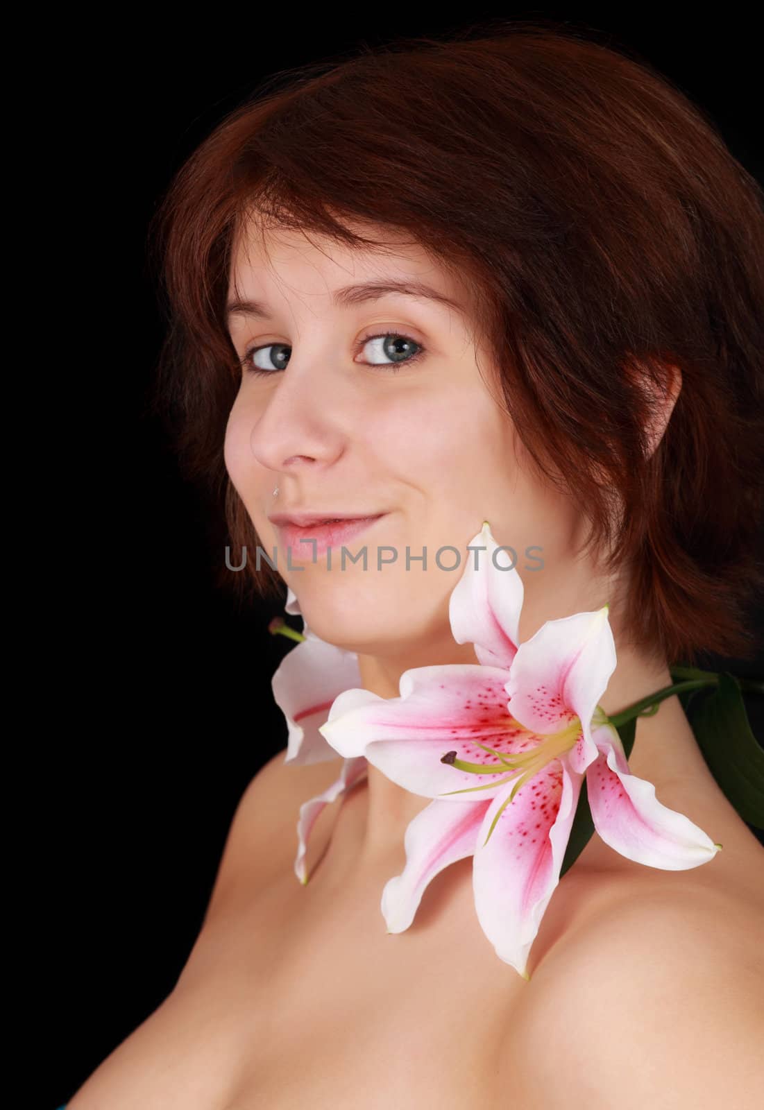 young caucasian woman with flowers on shoulder