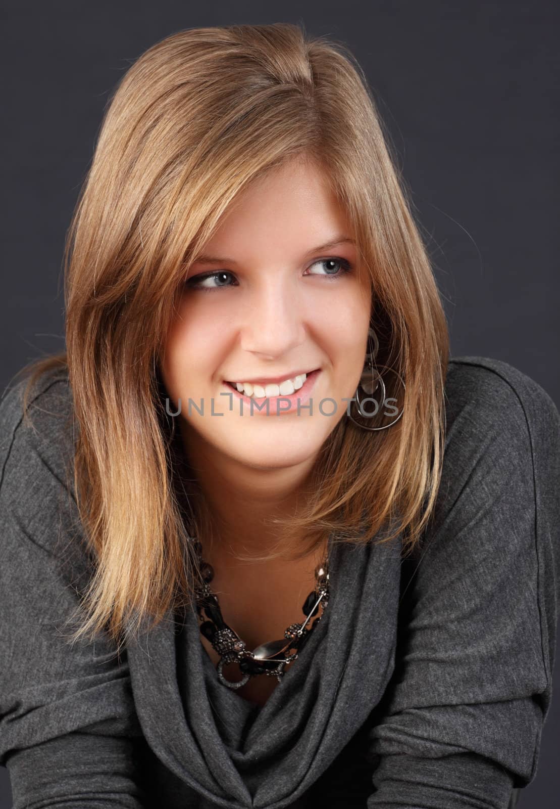 portrait of a young caucasian woman, dark background