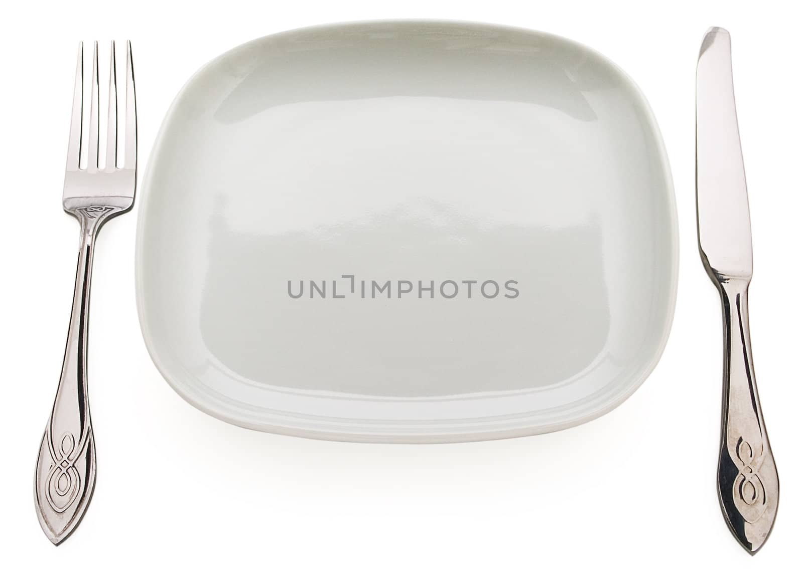 Table set: plate, fork, spoon and table knife. Concept of food