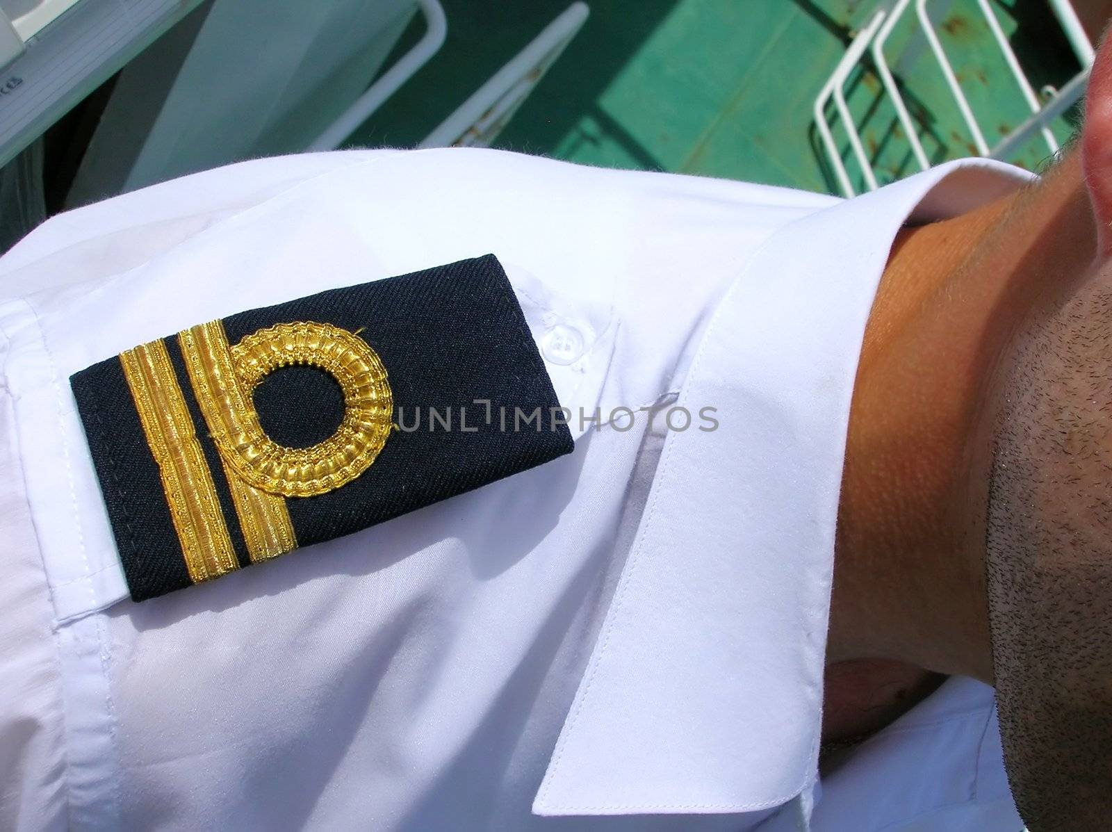 black epaulet on shoulder with gold tracks closeup
