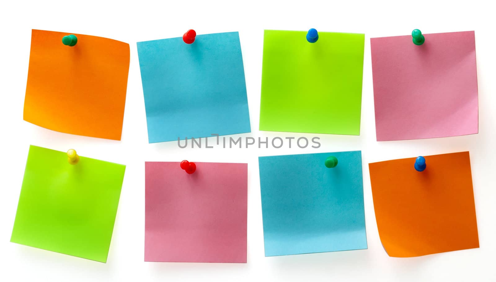 A different color post it note and pins isolated on white background