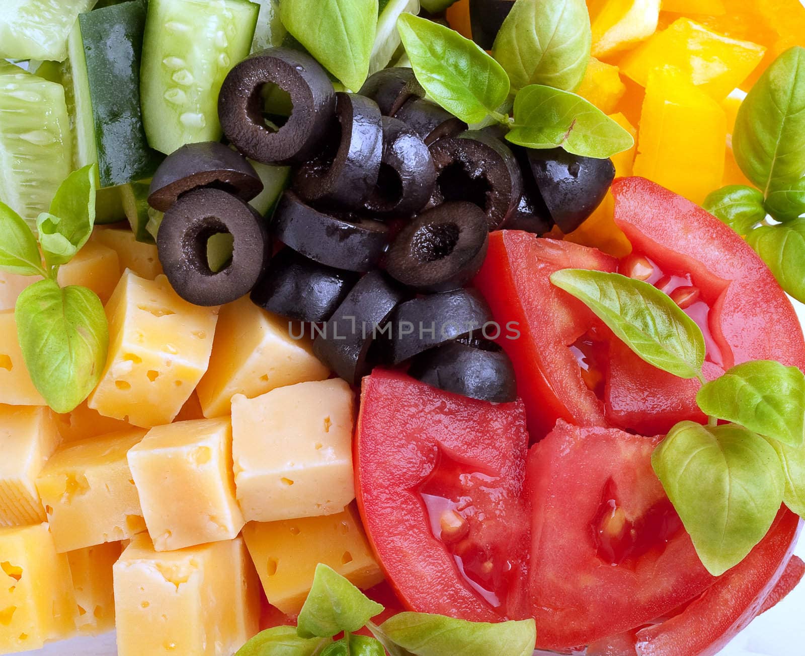 Salad Ingredients: tomatoes, cucumbers, olives and cheese