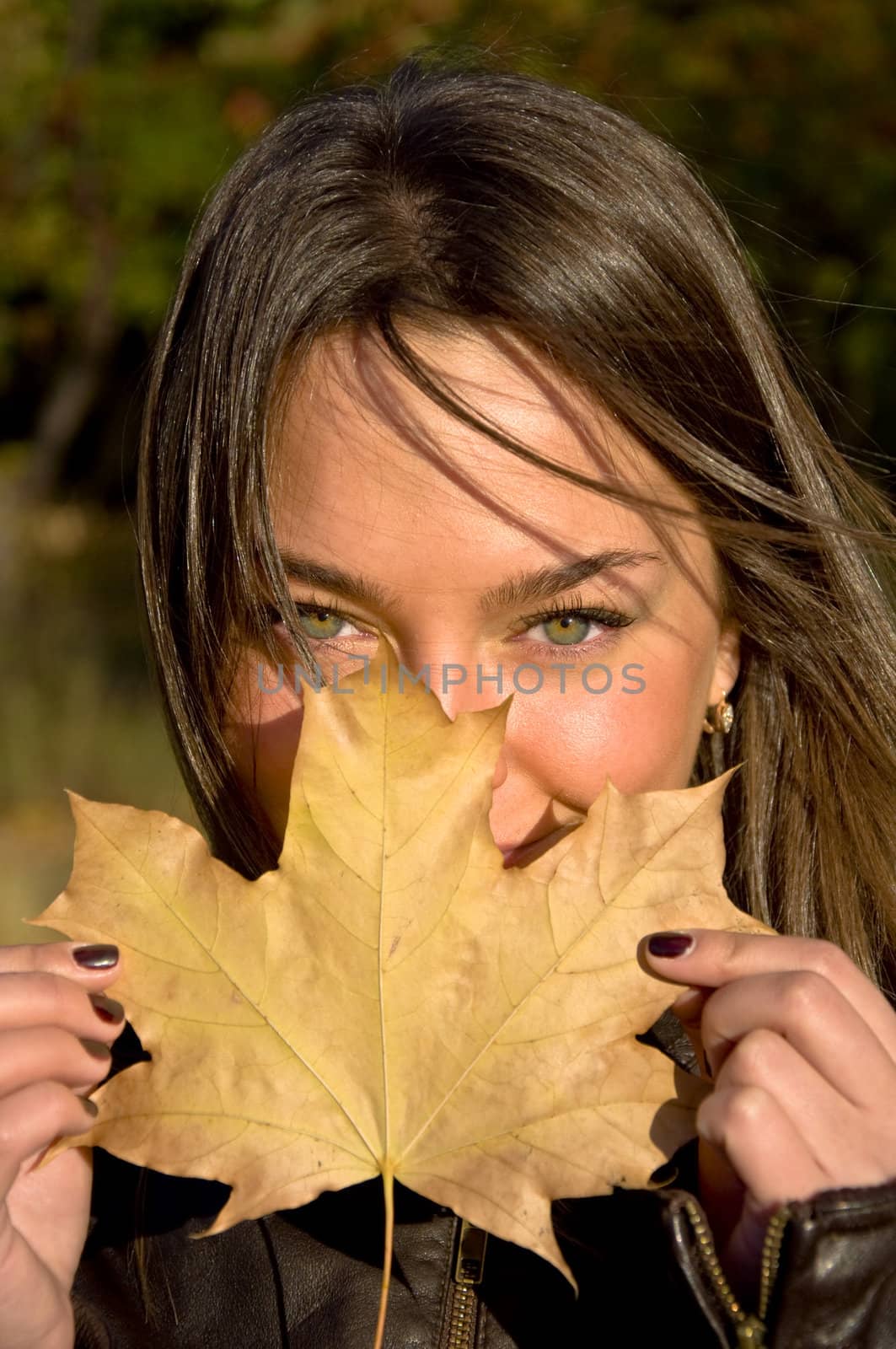 woman holding a maple leaf by Oledjio