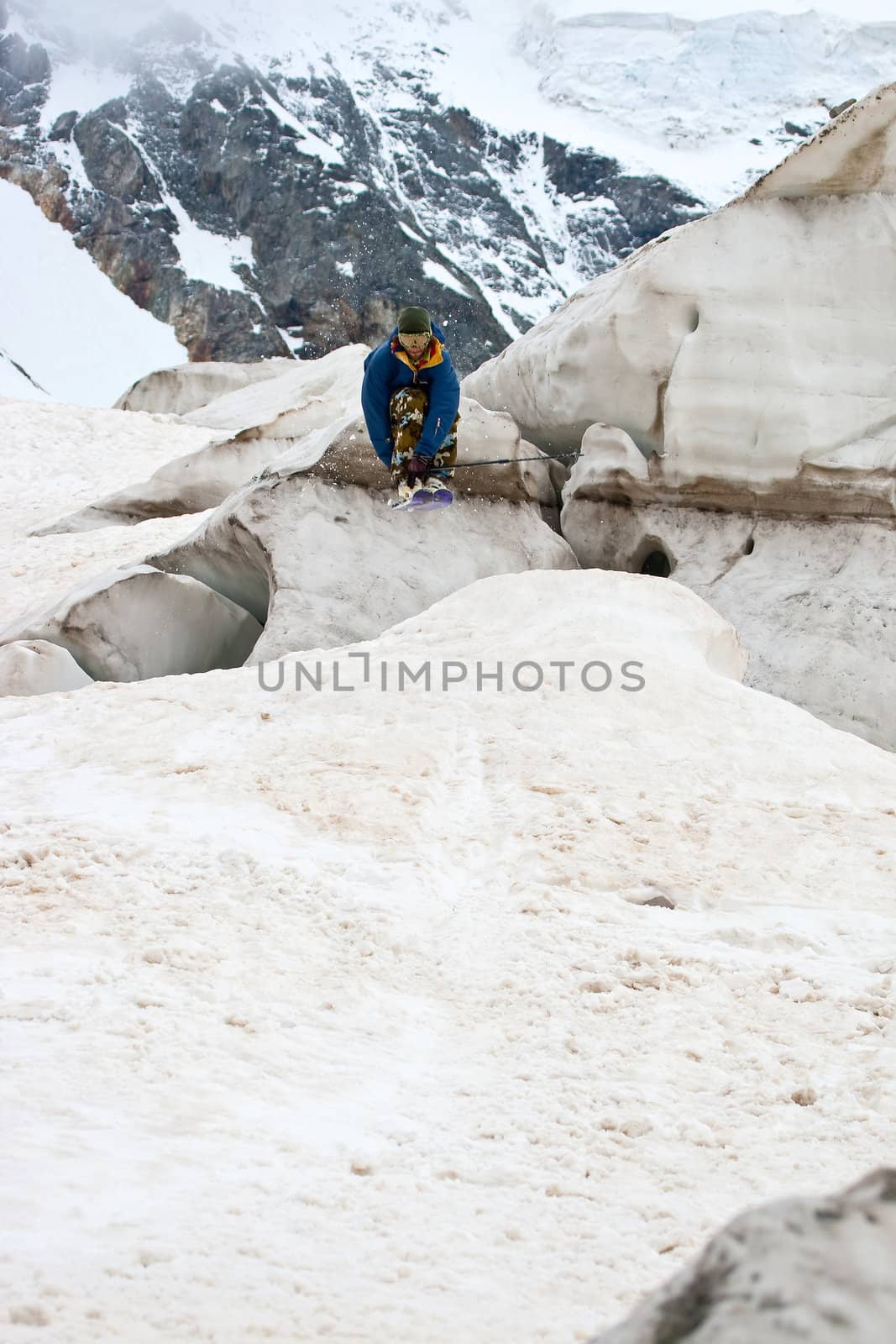 Freerider jumping in a mountains, Caucasus, Elbrus, summer