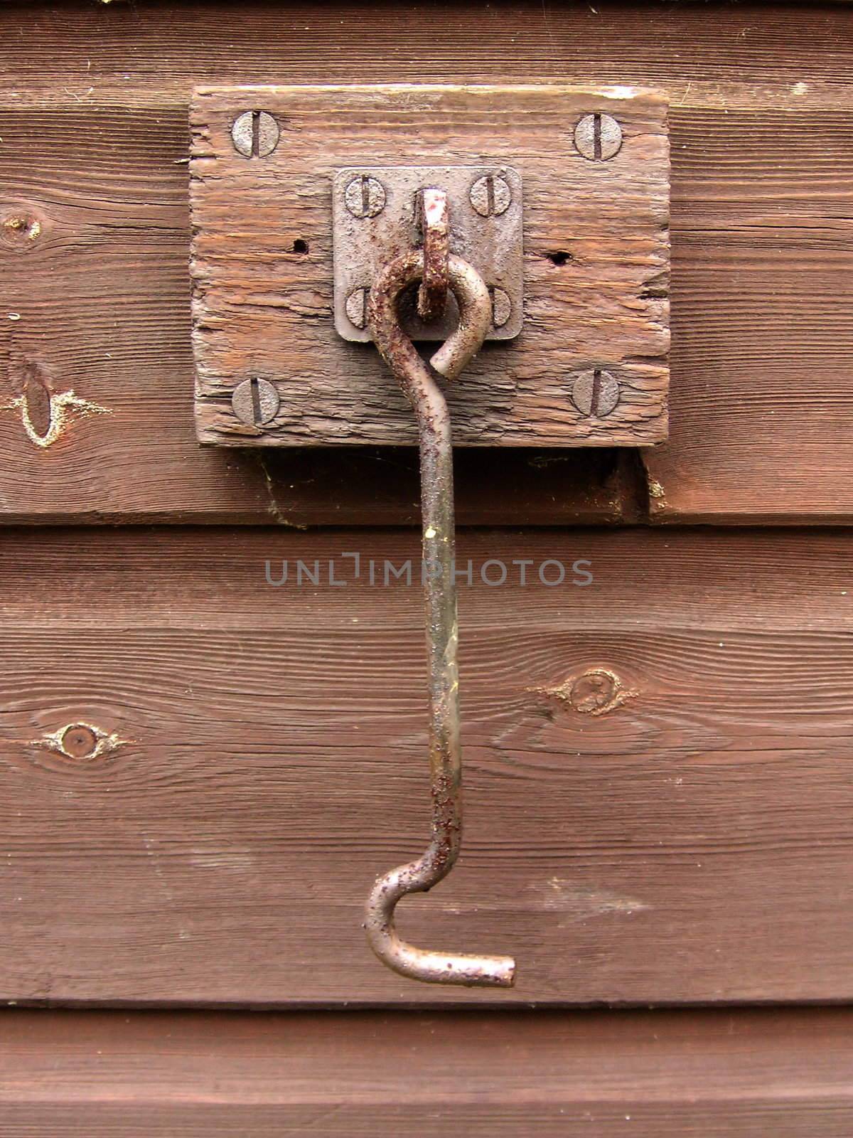 latch hook fastened to the side of a shed