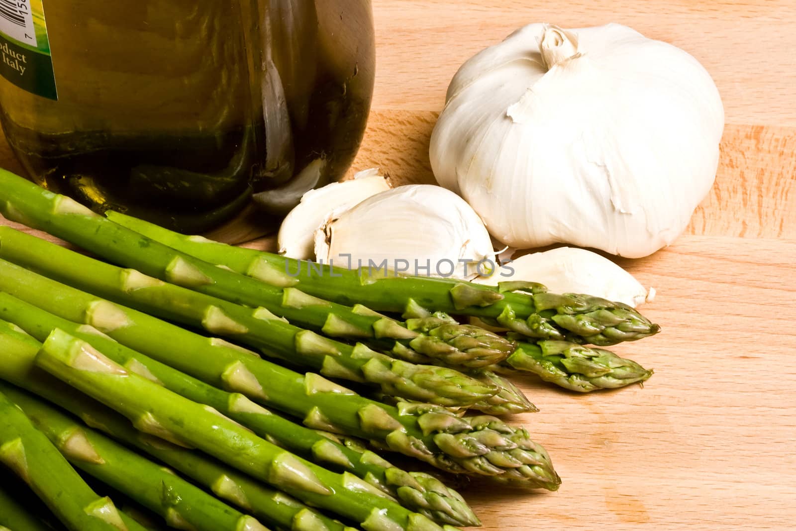 fresh asparagus and garlic on a cutting board healthy