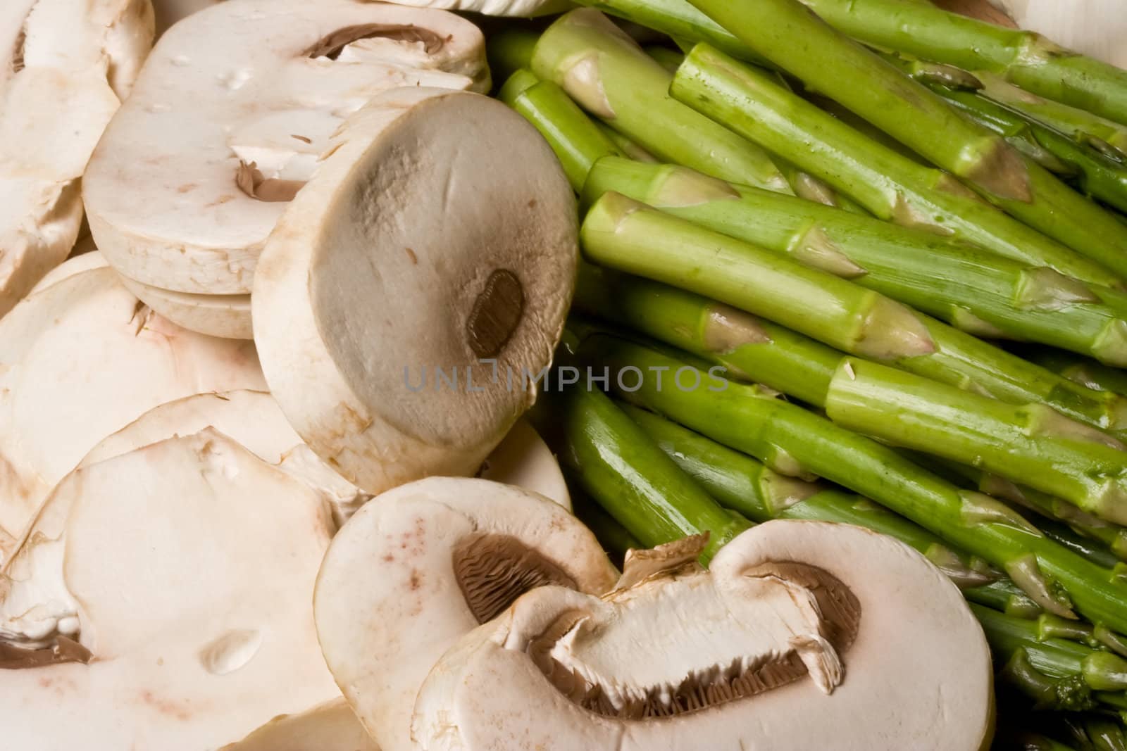 fresh mushrooms and asparagus on a cutting board healthy