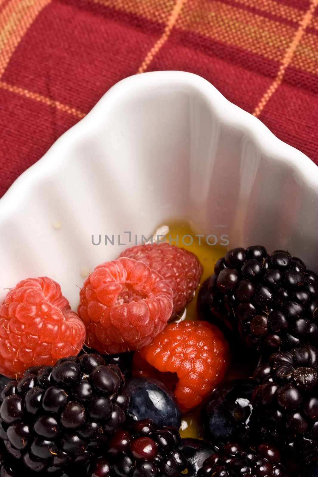 healthy white bowl of ripe fruit in syrup 