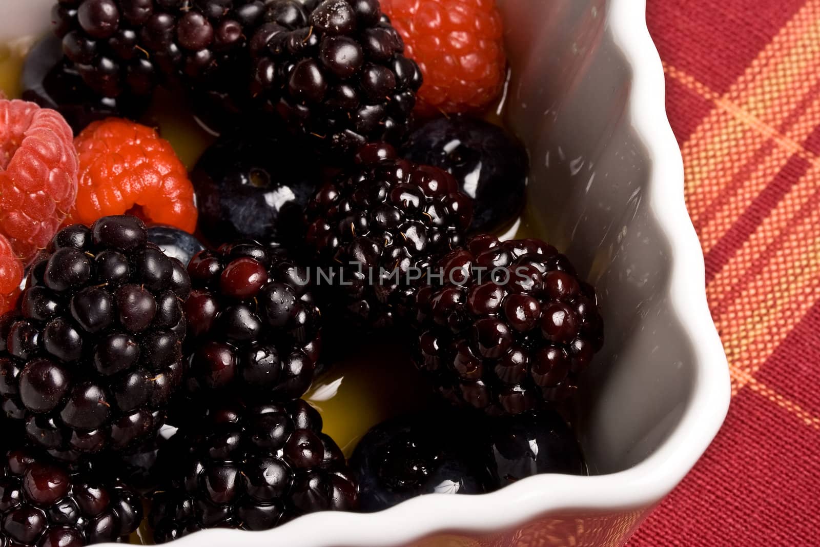 healthy white bowl of ripe fruit in syrup 