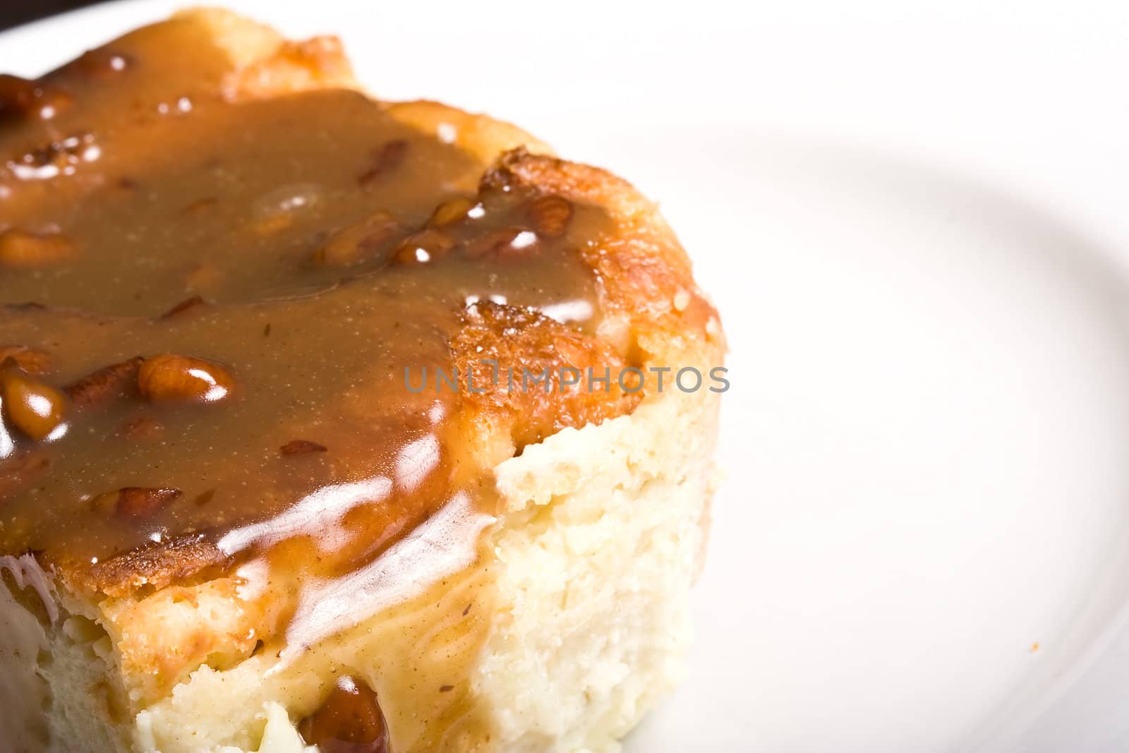 fresh hot bread pudding topped with caramel syrup and pecans