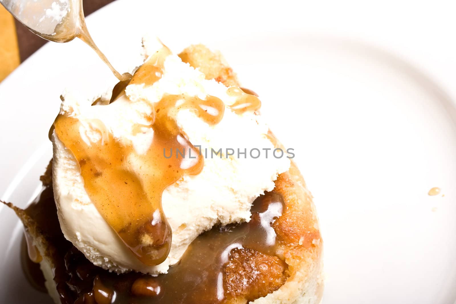 fresh hot bread pudding topped with caramel syrup and pecans