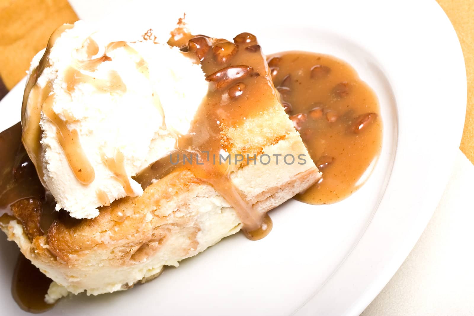 fresh hot bread pudding topped with caramel syrup and pecans