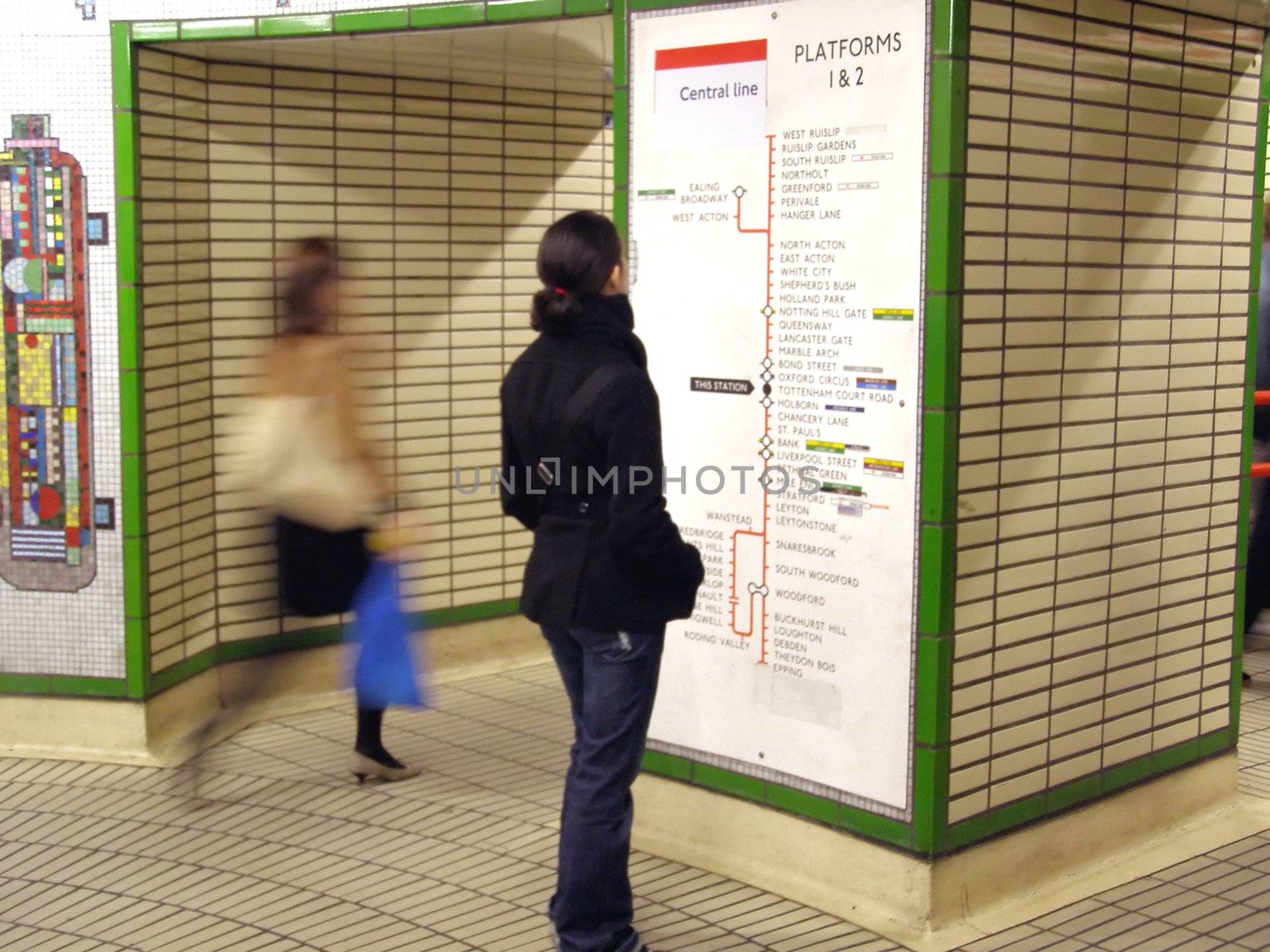 Girl wallking in the London Tube underground