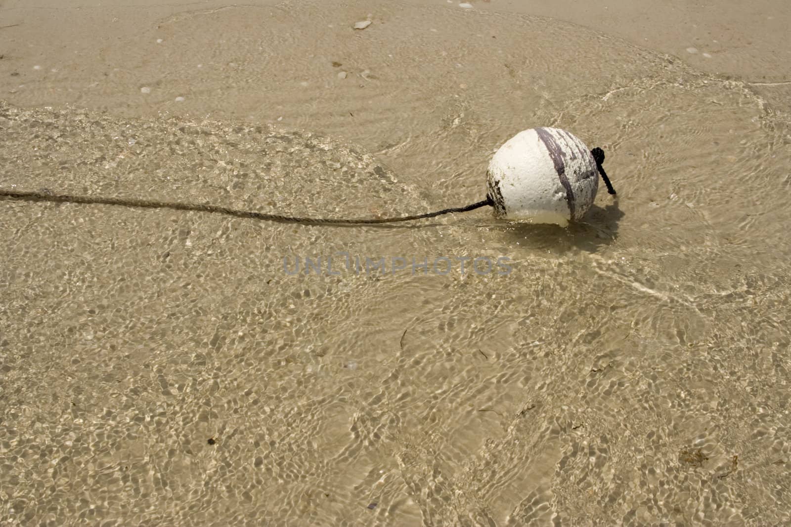 buoy floating alone in the ocean looking lonely