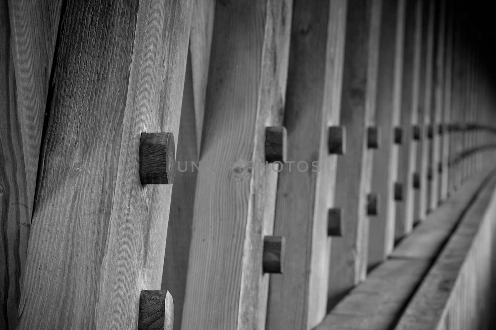 the lumber used to build an covered bridge close up of the detail, then fading to blur