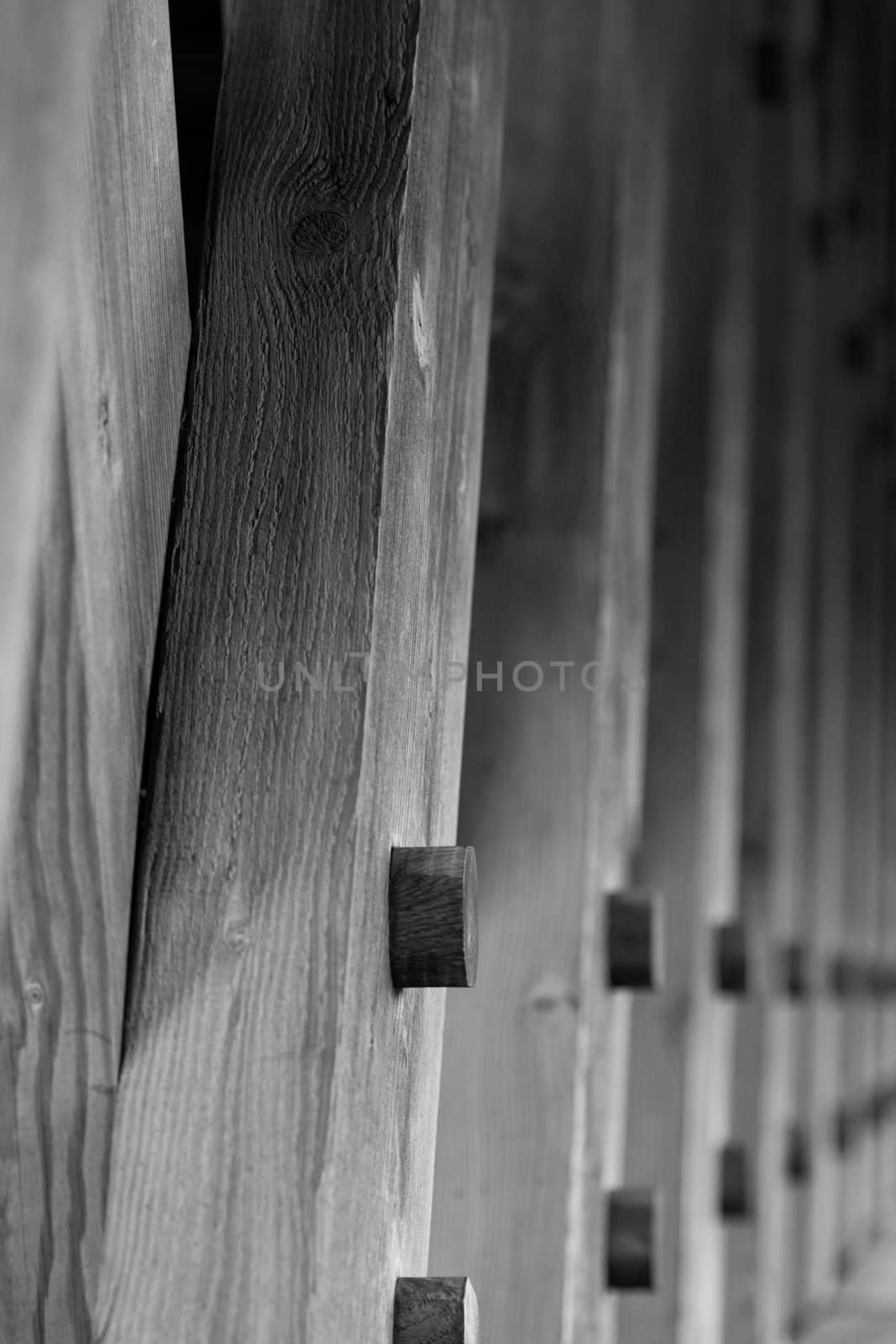 the lumber used to build an covered bridge close up of the detail, then fading to blur