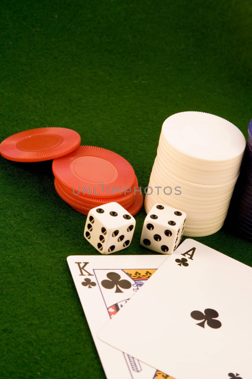 close up of cards and chips on green felt with winning hand