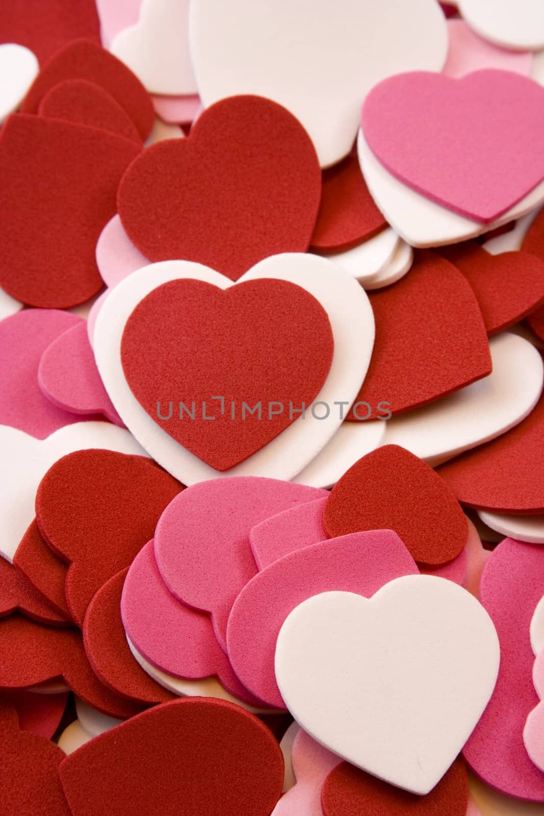 Heart foam cut outs stacked on top of each other pink, red, and white nice background image