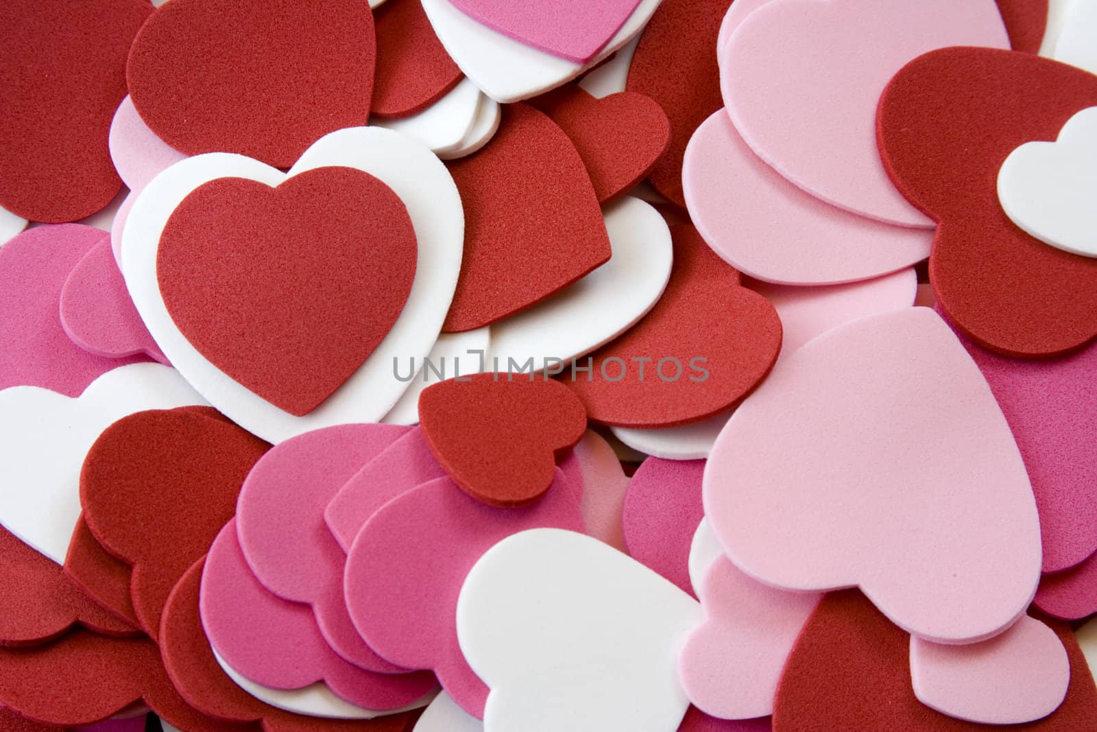 Heart foam cut outs stacked on top of each other pink, red, and white nice background image