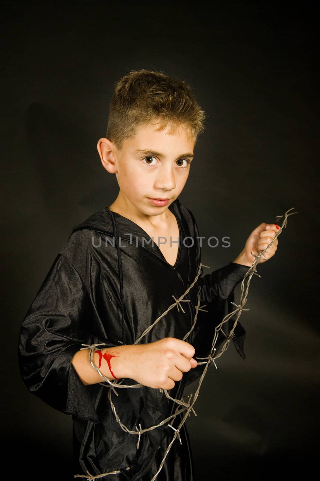 on boy with barbed wire, dressed for halloween.
