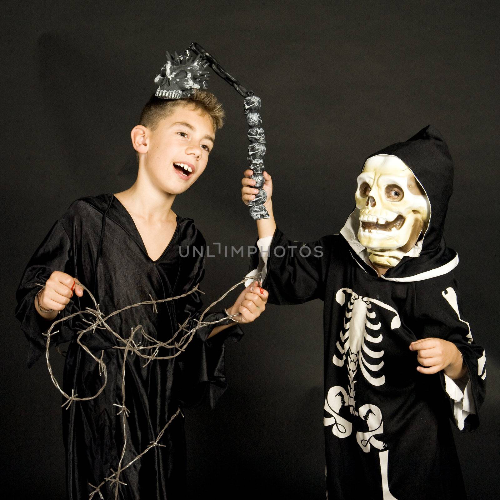 two children, dressed for halloween.