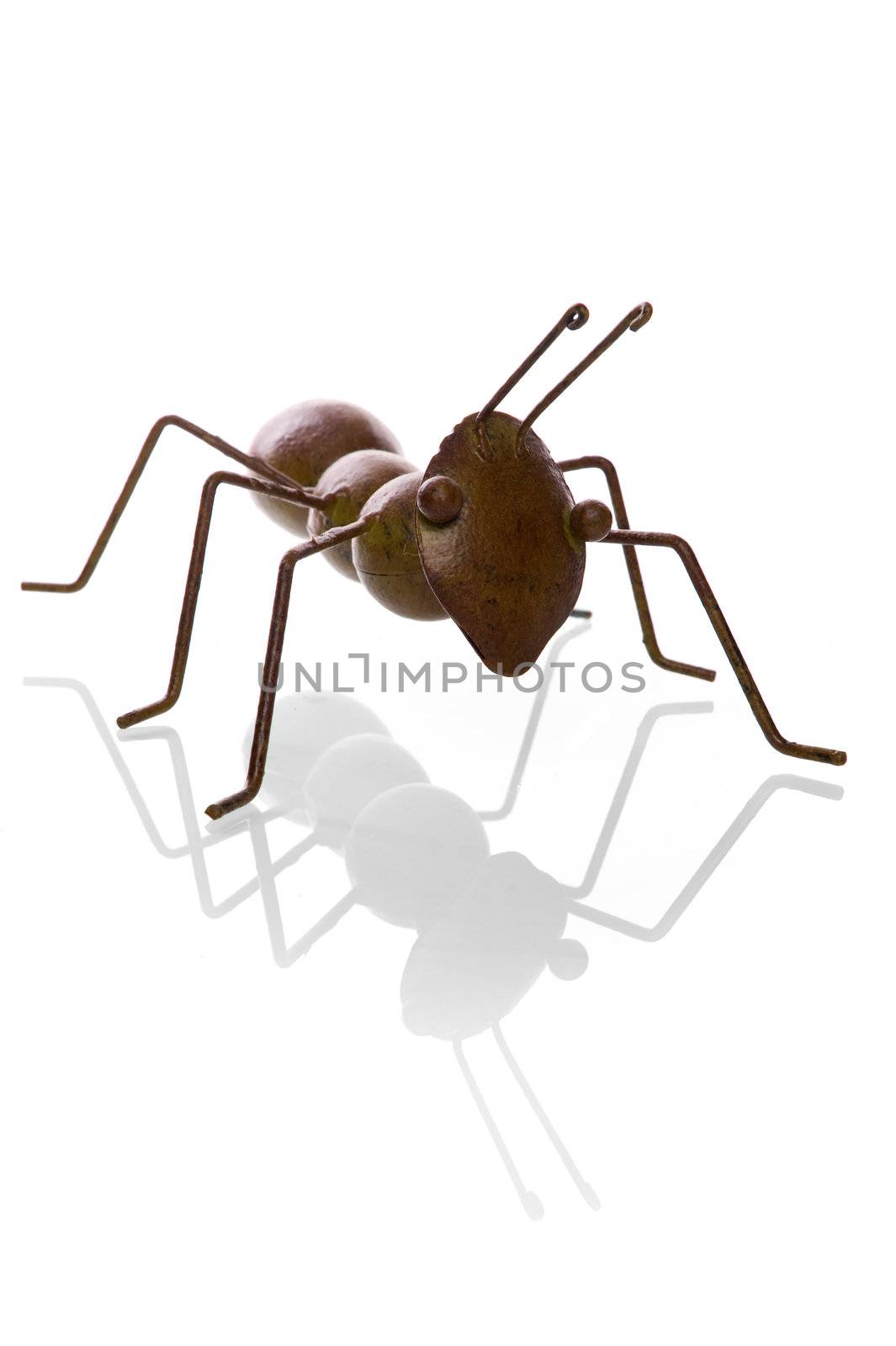 an ant, made of metal on a white background