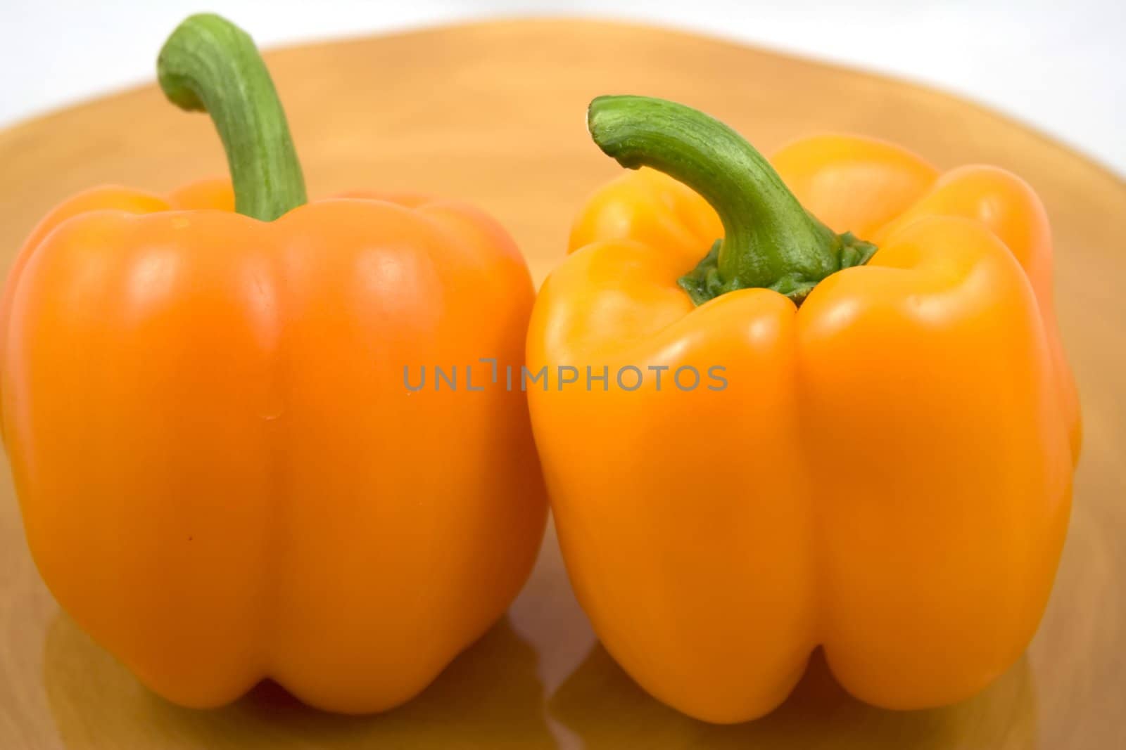 Orange peppers on a plate waiting for the salad
