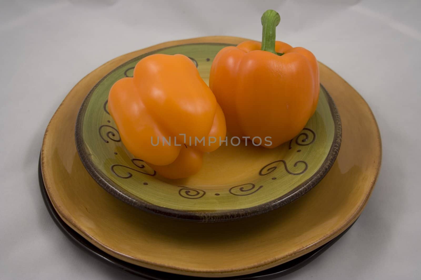 Orange peppers on a plate waiting for the salad
