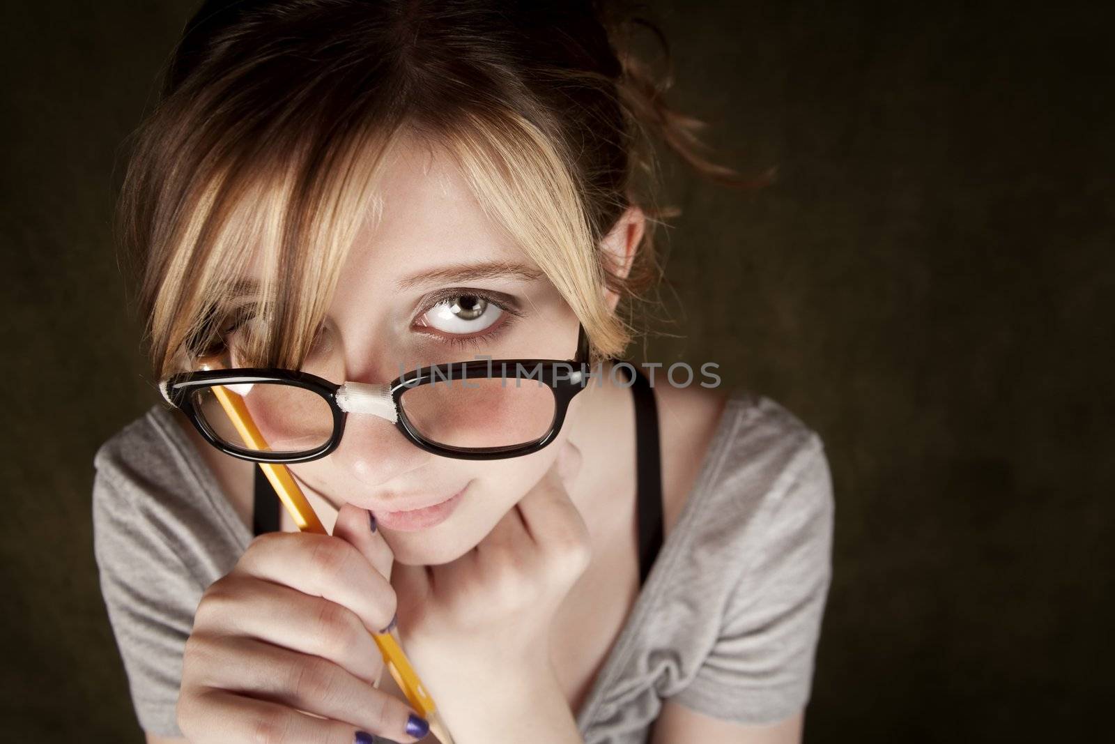 Portrait of nerdy teen girl with green eyes