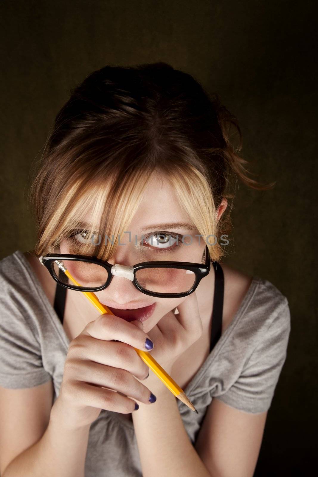 Portrait of nerdy teen girl with green eyes
