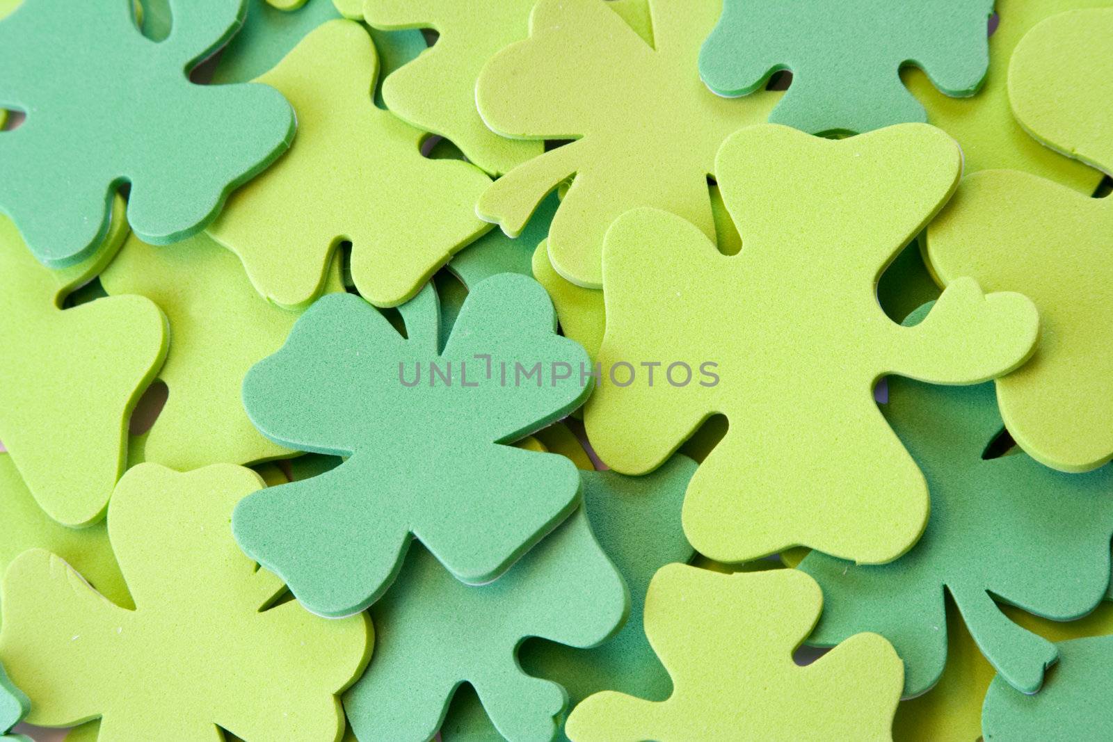 Foam shamrocks stacked on top of each other nice  background for the web