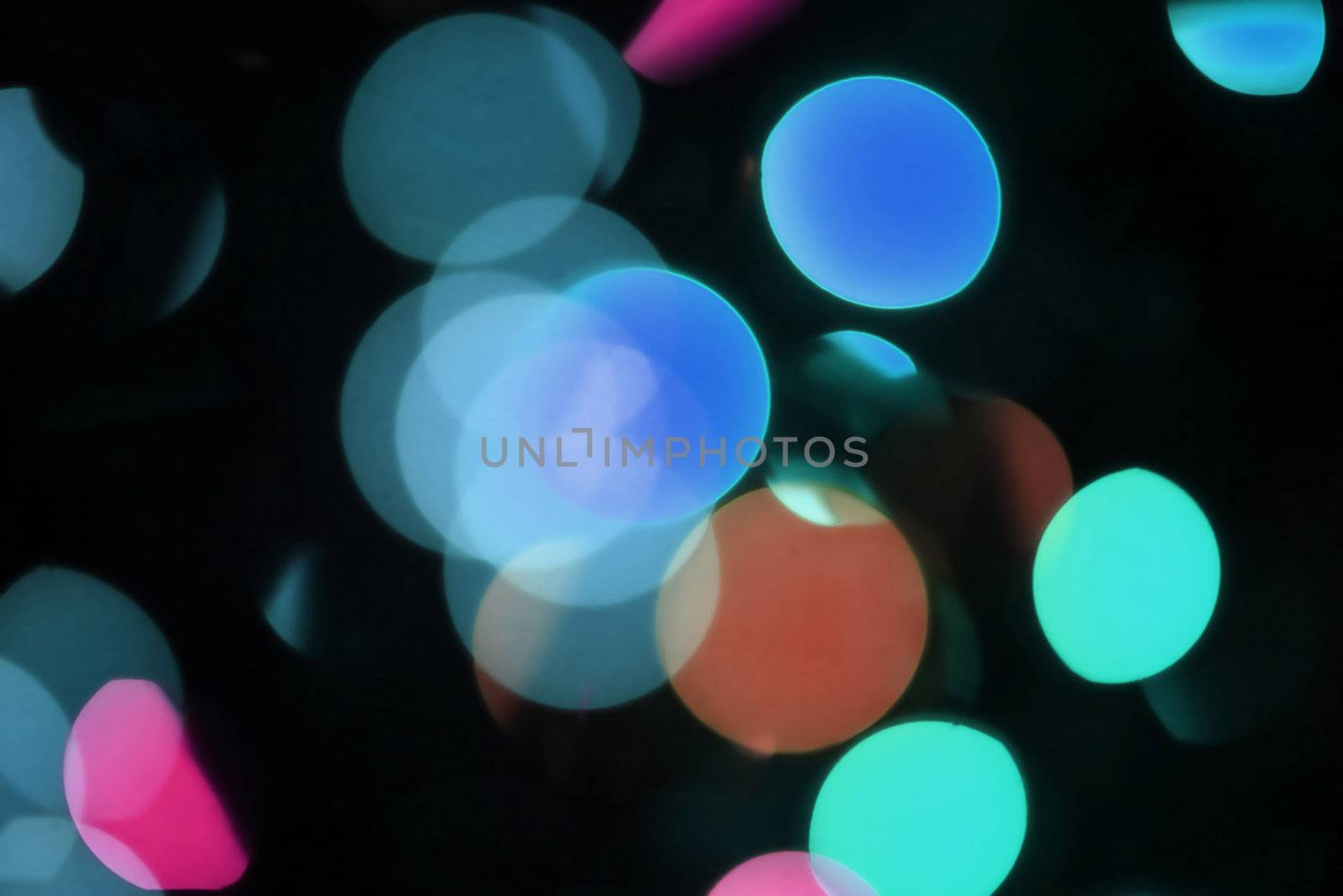 Lights shot purposefully out of focus. Could yse as a lens flare. Great use for a holiday or festive background!