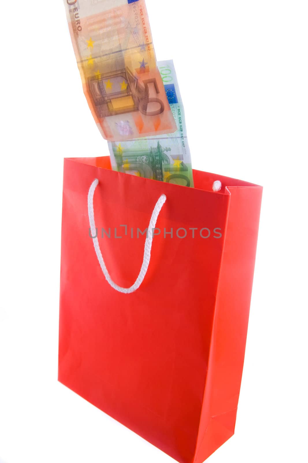 Concept of money falling in shopping bag. Blur on banknotes for motion.
