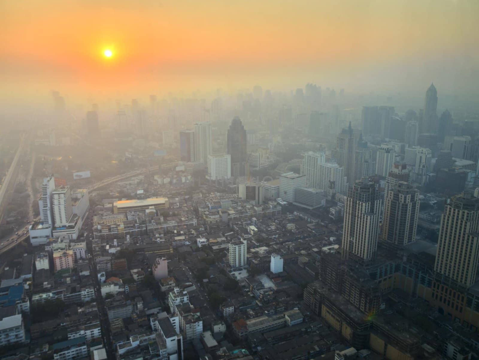 Aerial view to Bangkok downtown on a sunrise. Thailand