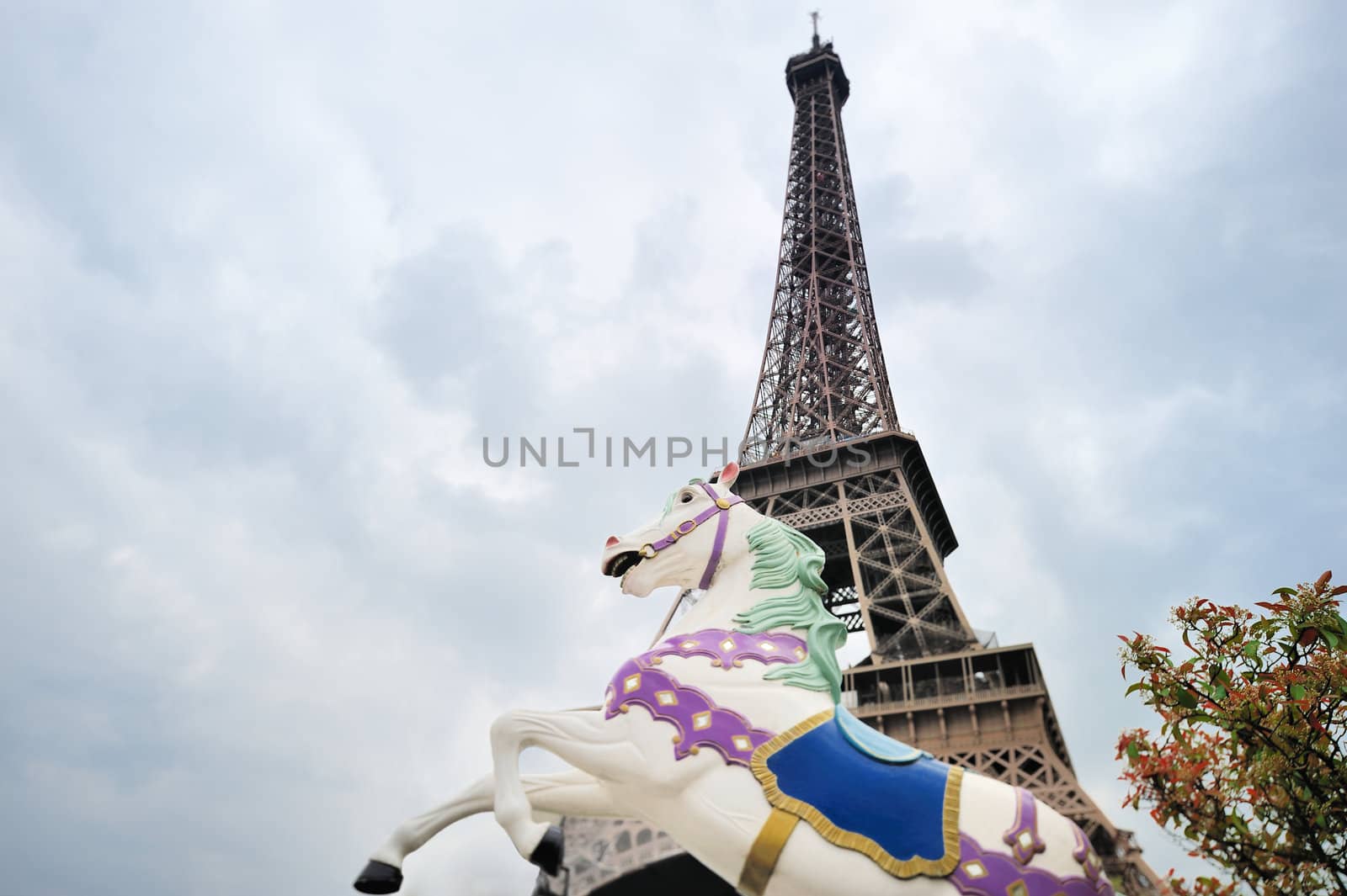 Decorative sculpture galloping horse on background Eiffel tower