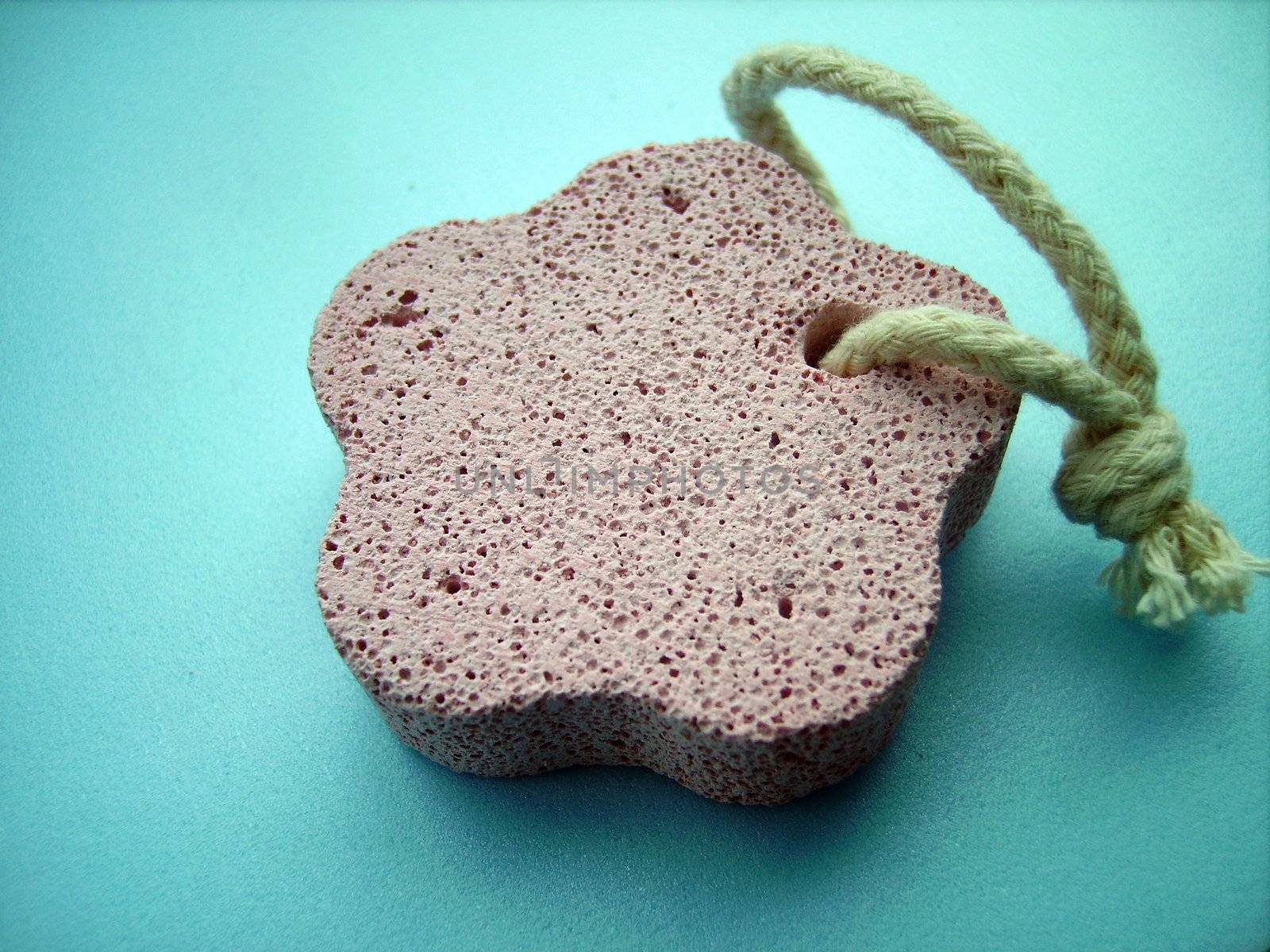 a close detail of a pink pumice stone