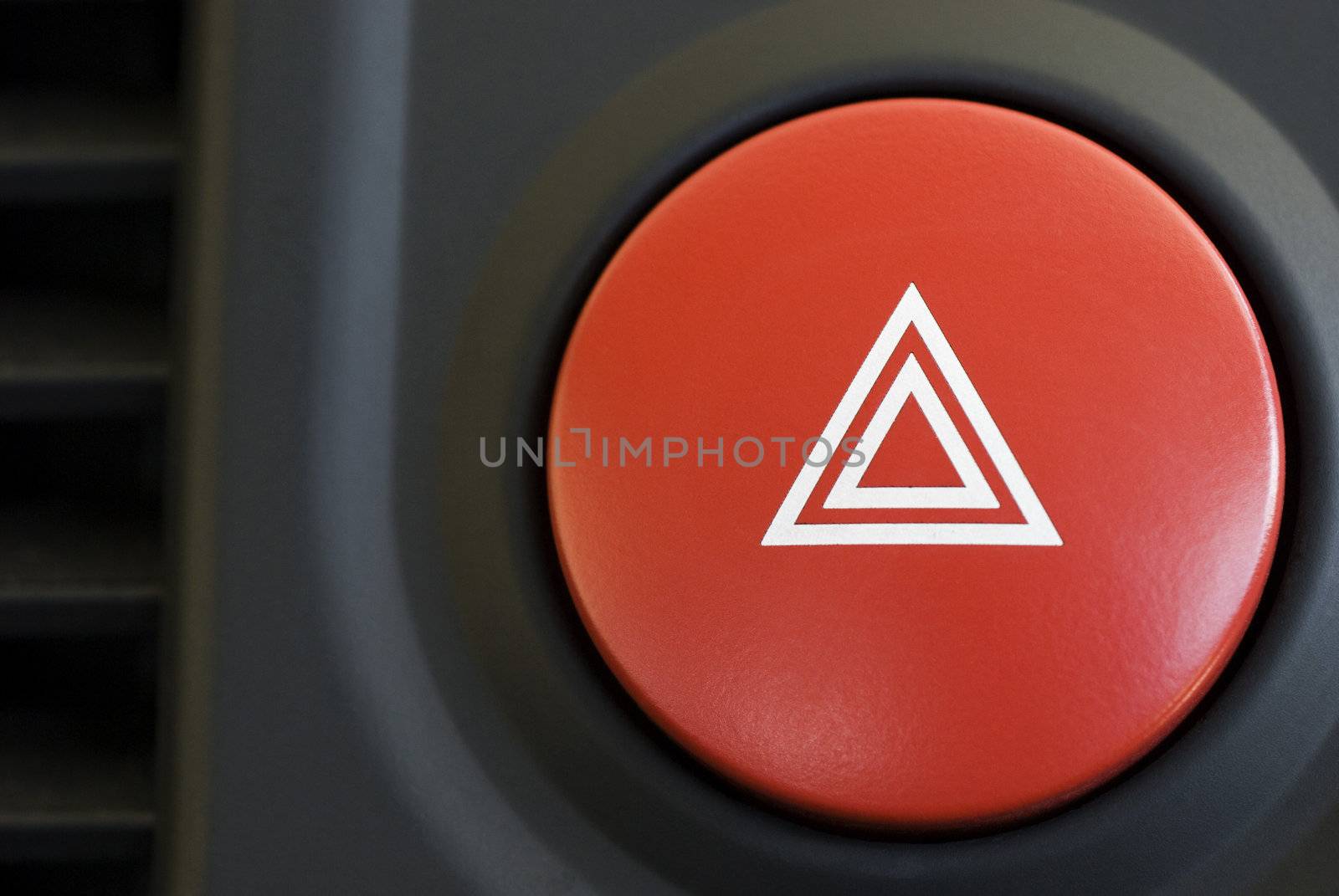 a hazard warning flasher button from a car dashboard