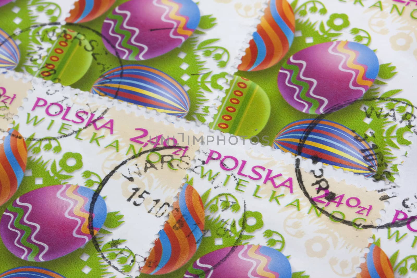 Easter (Wielkanoc in Polish) - colorful eggs and floral folk decorations on old post stamps from Poland canceled in Warsaw 